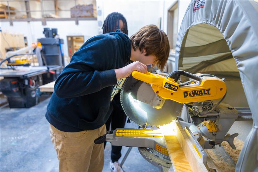 Students build doghouses
